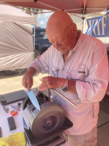 Sharpening Knife at in Person Booth in Galveston