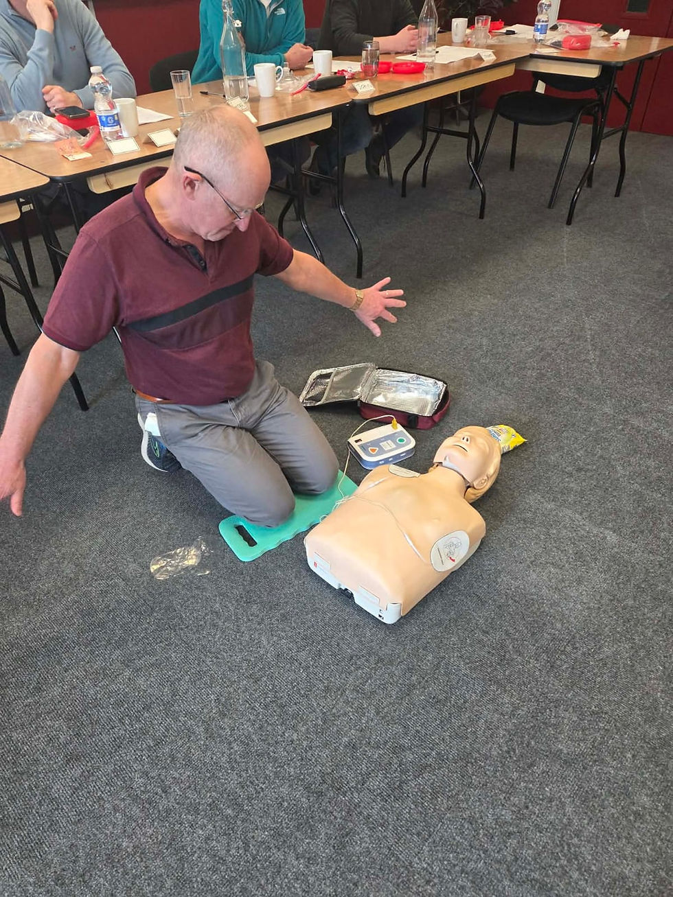 Seamus McElroy using an Automated External Defibrillator (AED) ...with style