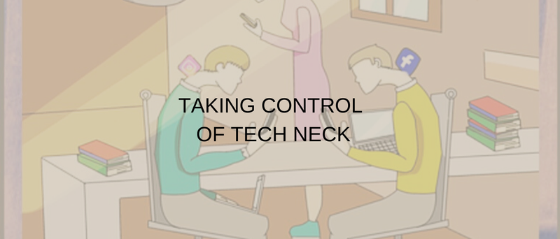 Office workers hunched over their desks and their phones and computers using social media and work a
