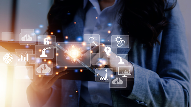 A professional engaged with a digital tablet, surrounded by holographic icons representing technology and innovation, illustrating the integration of digital solutions in business and industry.