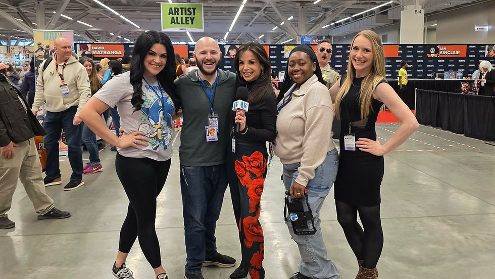 Cleveland 13's Nikkie Brown, Gremi, Hollie Strano, Cha'Ron Conner and Kayla Royko posing at the Fan Expo while being photobombed by Reno 911!'s Thomas Lennon