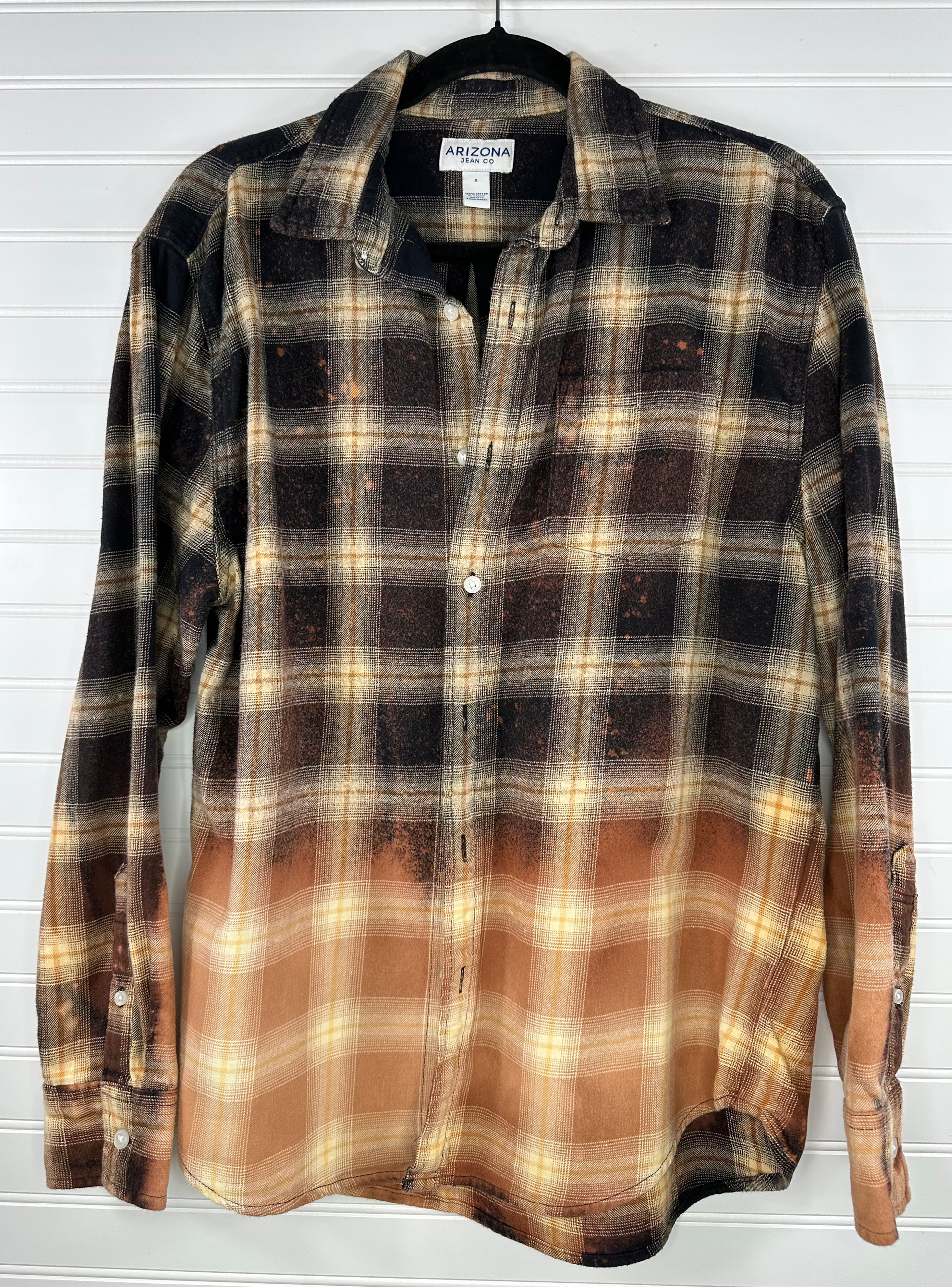 Black and cream plaid flannels with bleach splatter 