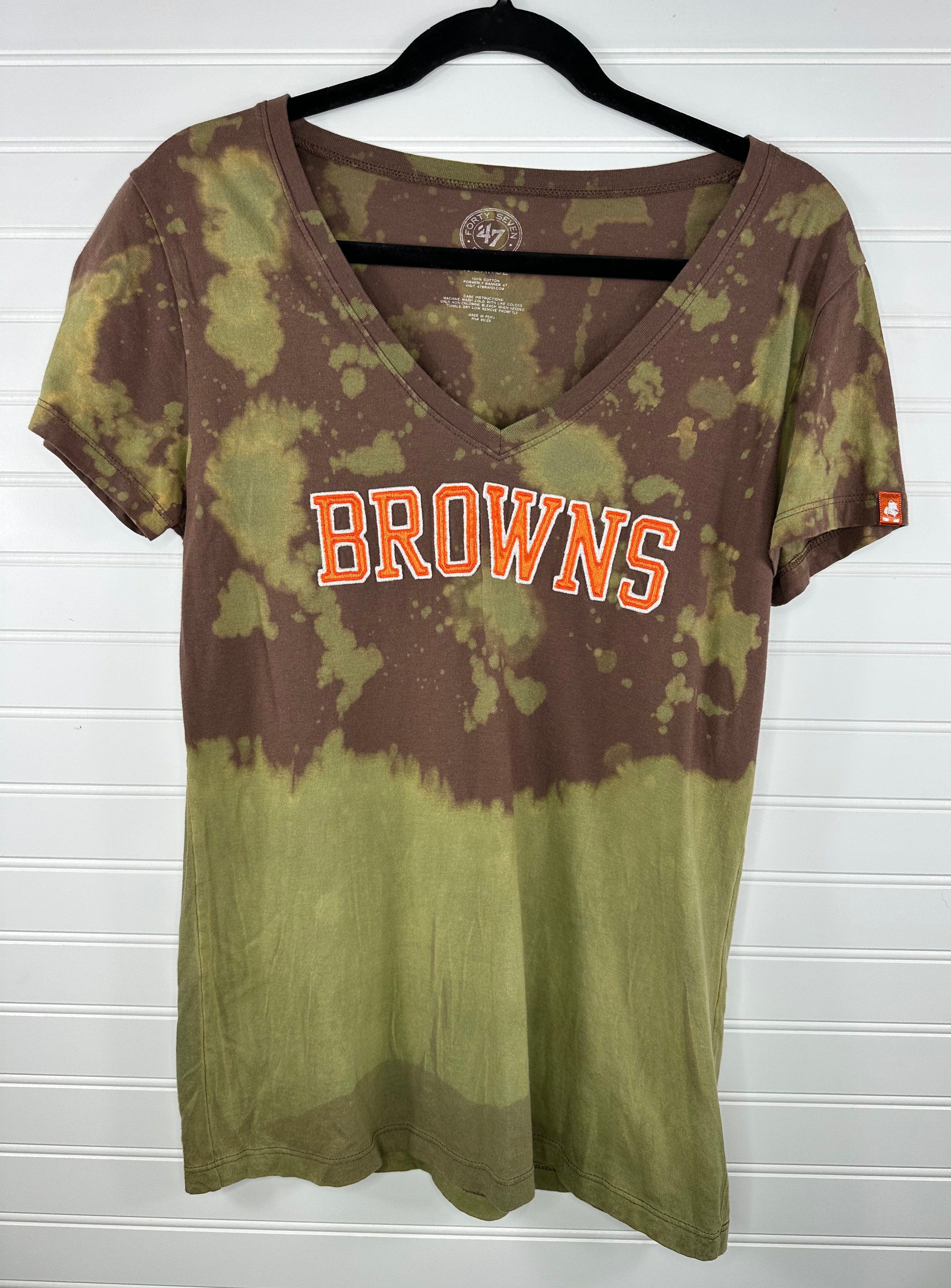Brown v-neck with Browns across the front and green bleach splatter