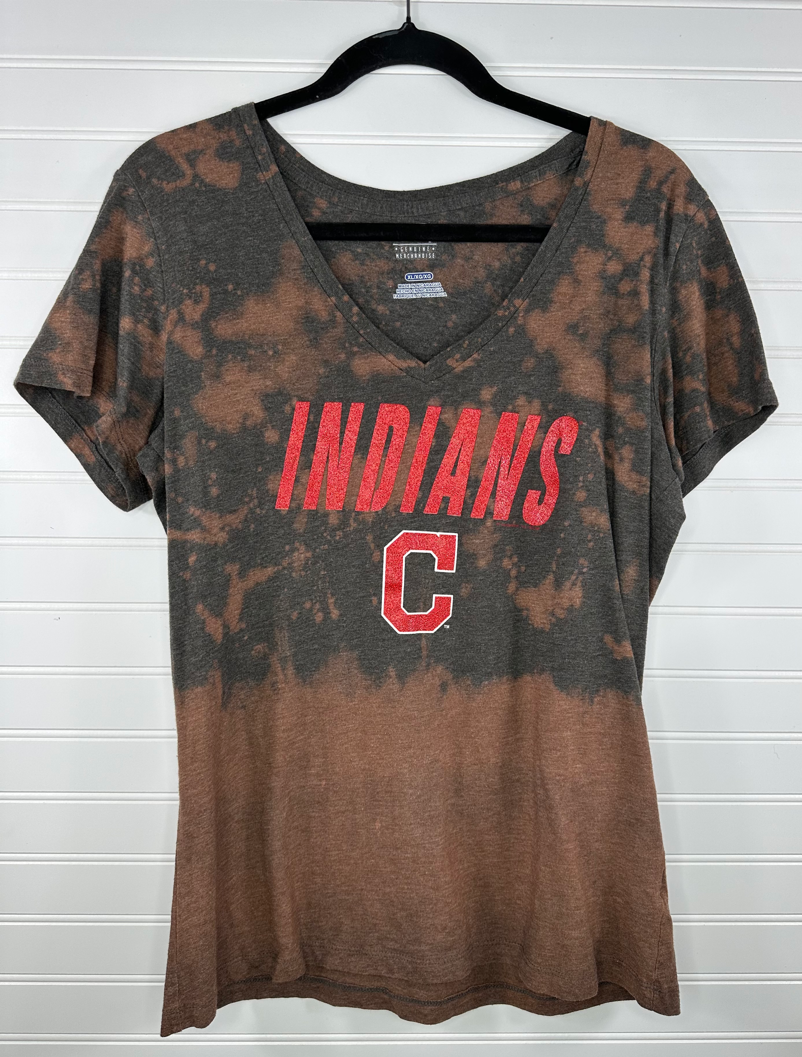 Indians with block C on a v-neck with bleach splatter 