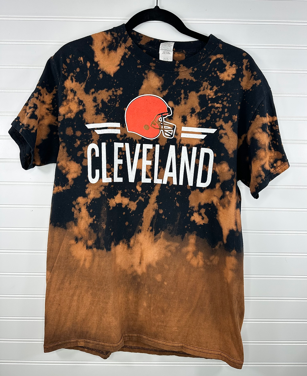 Cleveland with helmet graphic on a black t-shirt and orangish bleach splatter 
