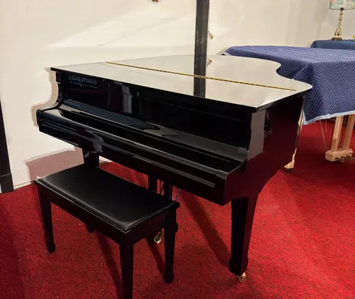 Closed black Yamaha G2J grand piano at Rockafellow Piano piano store in San Antonio Texas