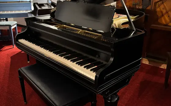 Full open view of Starr Grand Piano showing cabinet, rich finish, and grand design at Rockafellow Piano in San Antonio, Texas.