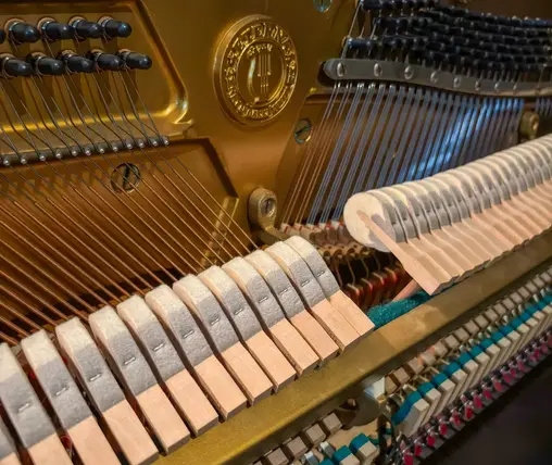 Eterna miniature upright piano action mechanism at Rockafellow Piano in San Antonio Texas