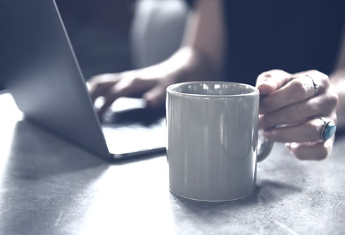 Beverage%20Mug%20and%20a%20Laptop_edited.jpg