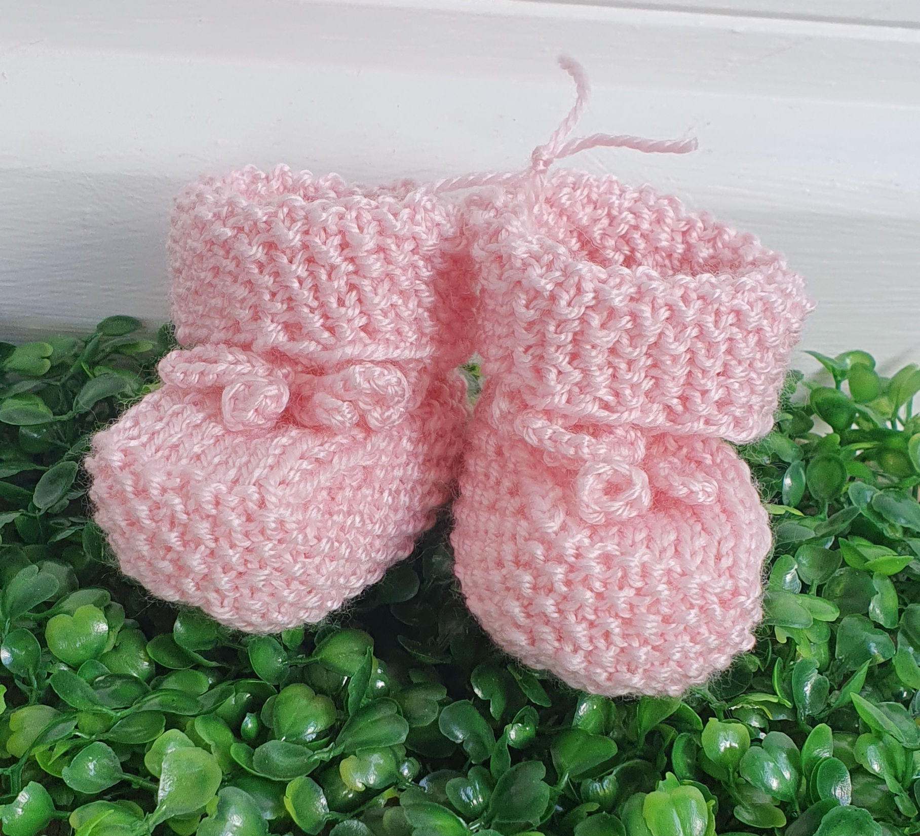 Pink knit baby booties