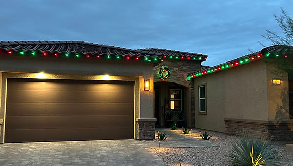 Red and Green roofline and wreath Christmas light installation in Henderson, NV by Happy Santa