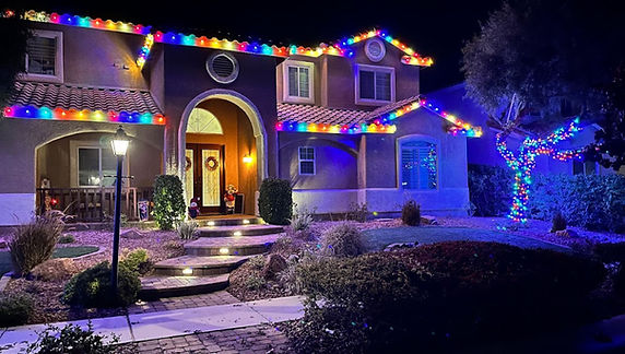 Multi color Christmas light installation in North Las Vegas, NV by Happy Santa Holiday Lights