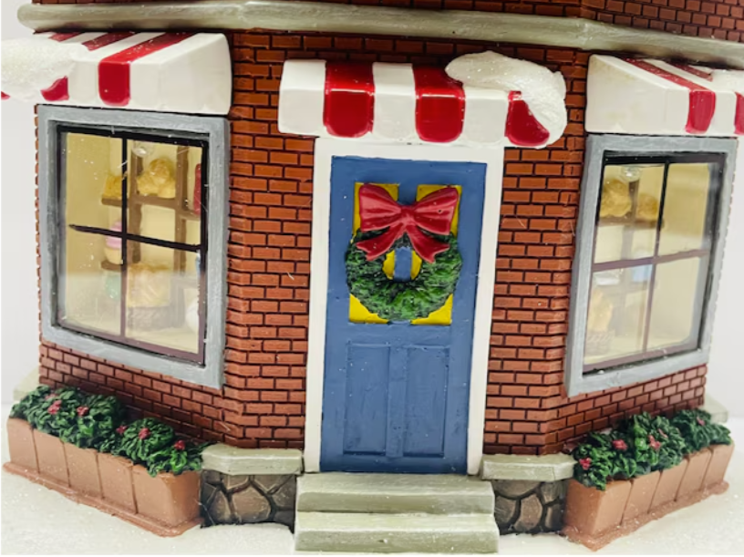 Thumbnail: Carole Towne brick shop with blue door and wreath