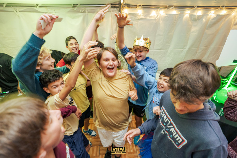 a group of young boys are dancing at a party sponsored by atepa