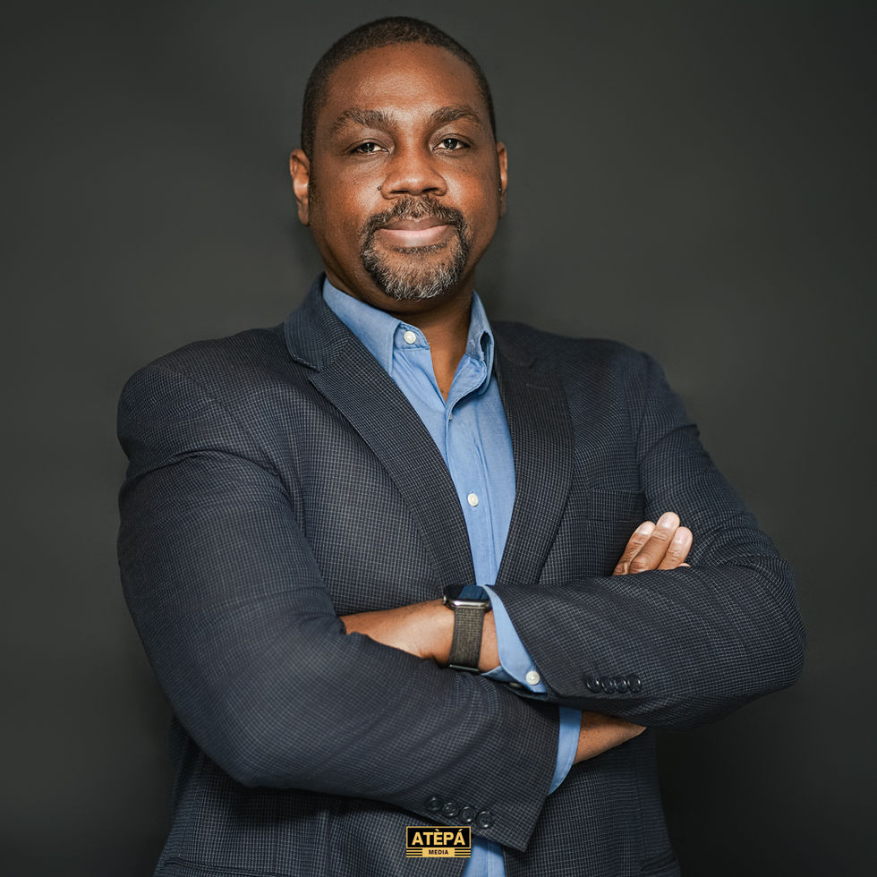 a man with his arms crossed is wearing an atepa logo