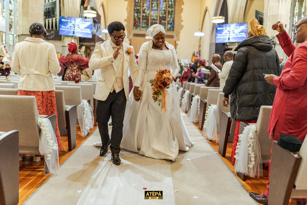 a bride and groom walk down the aisle of a church with a photo taken by atepa