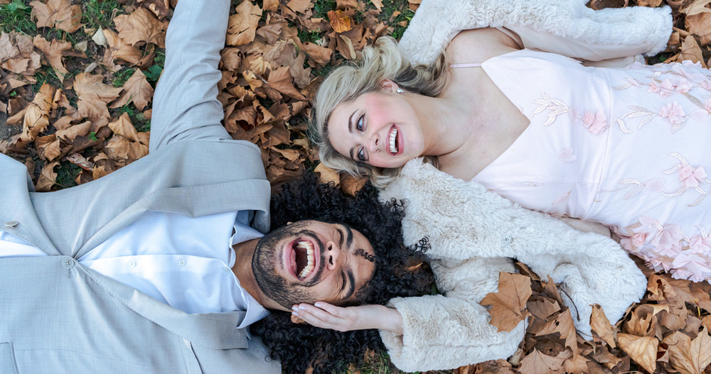 Couple with their bouquet on a scenic day