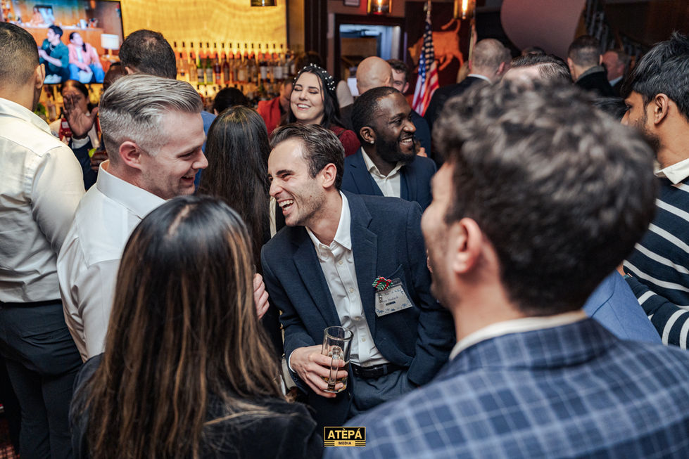 a group of people are gathered at a party sponsored by atepa