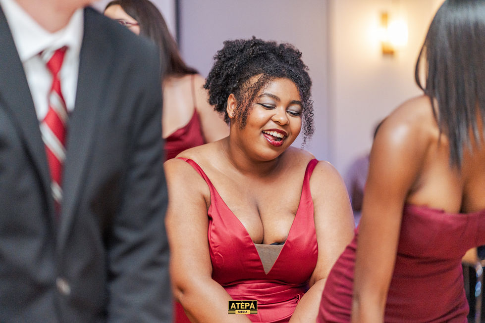 a woman in a red dress with the word atepa on her chest
