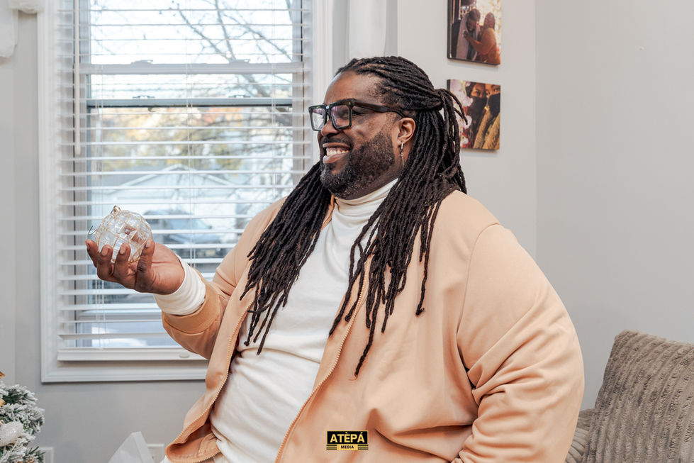 a man with dreadlocks is wearing a jacket that says atepa
