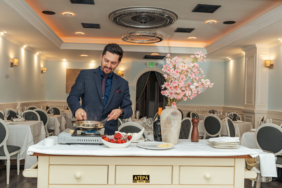a man in a suit prepares food in front of a sign that says exit