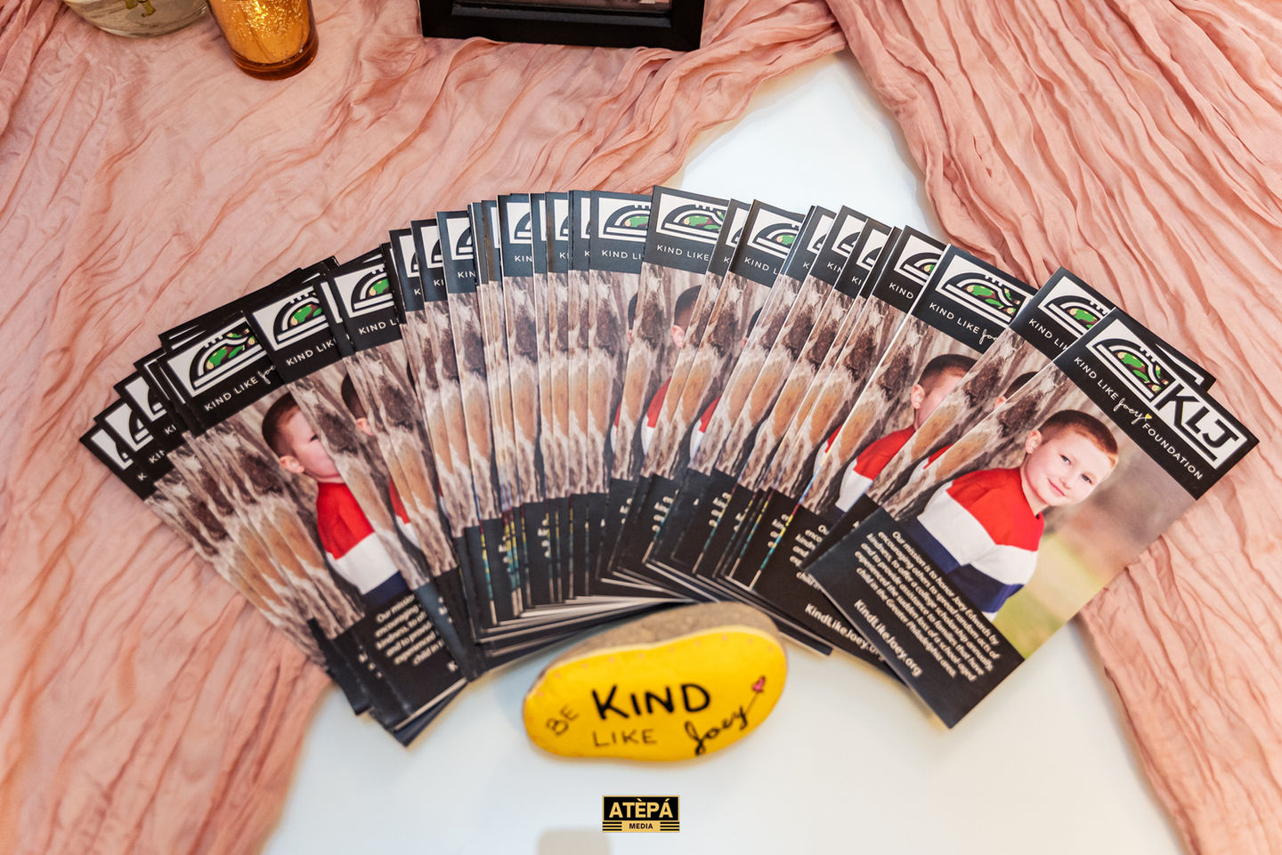 Flyers arranged in a fan shape on a table.