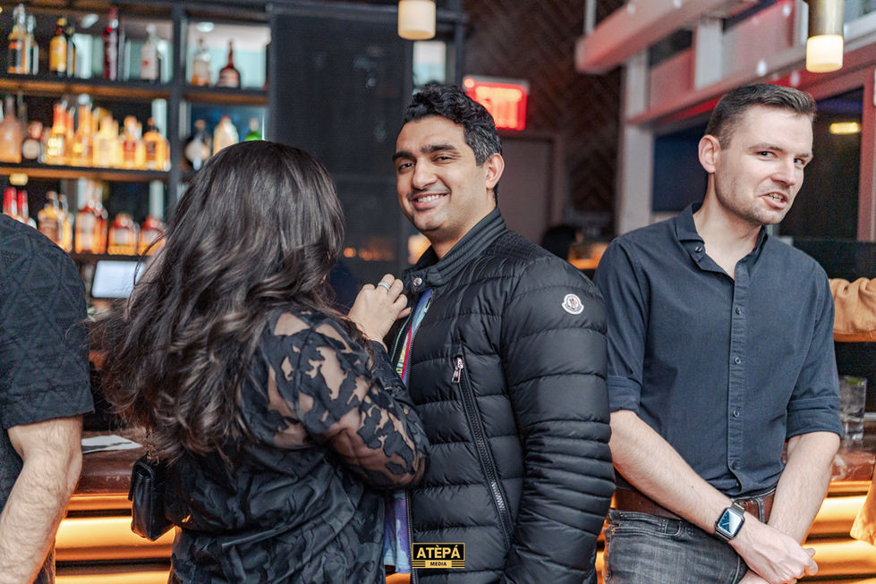 a man wearing a black jacket with the word atepa on it