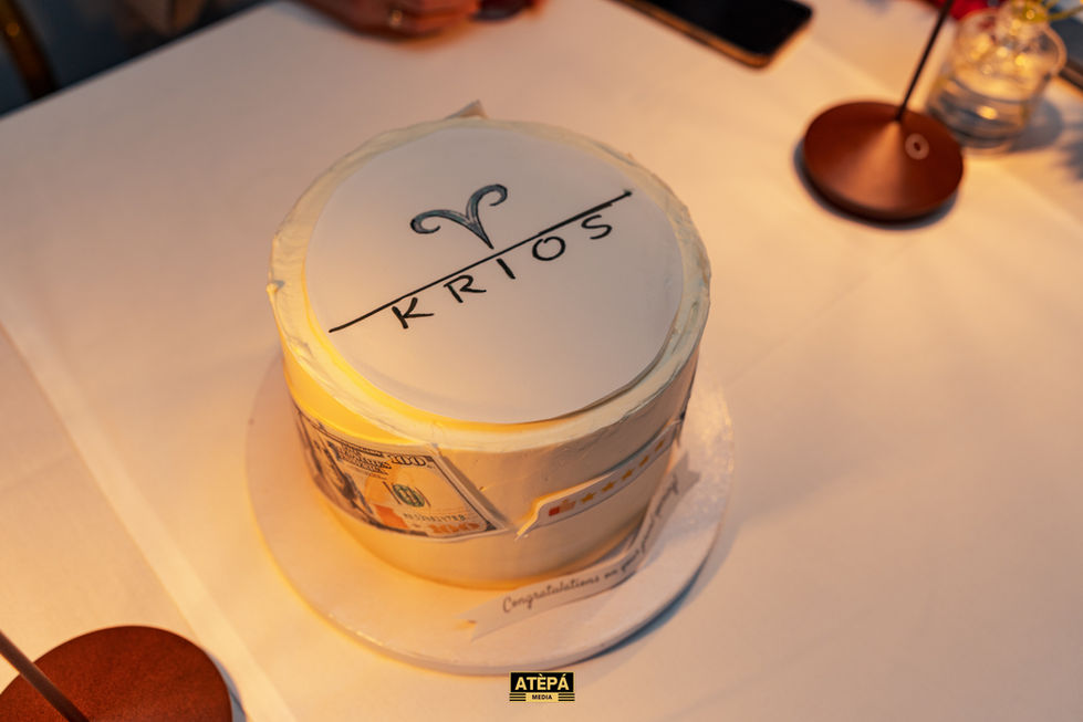 a white cake with the word krios on it