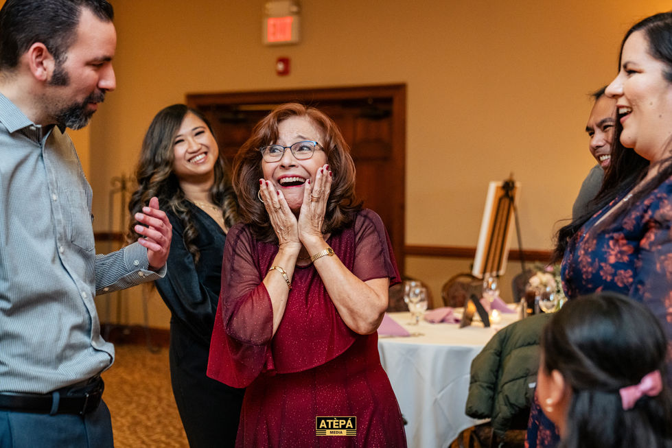 Two people smiling and posing at an event.