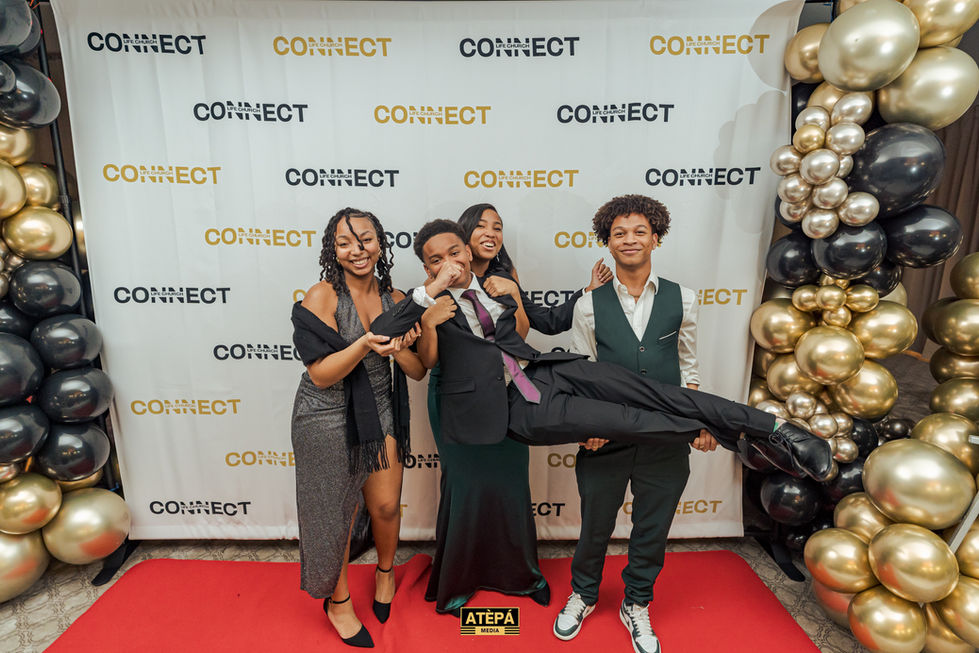 a group of people pose in front of a connect backdrop