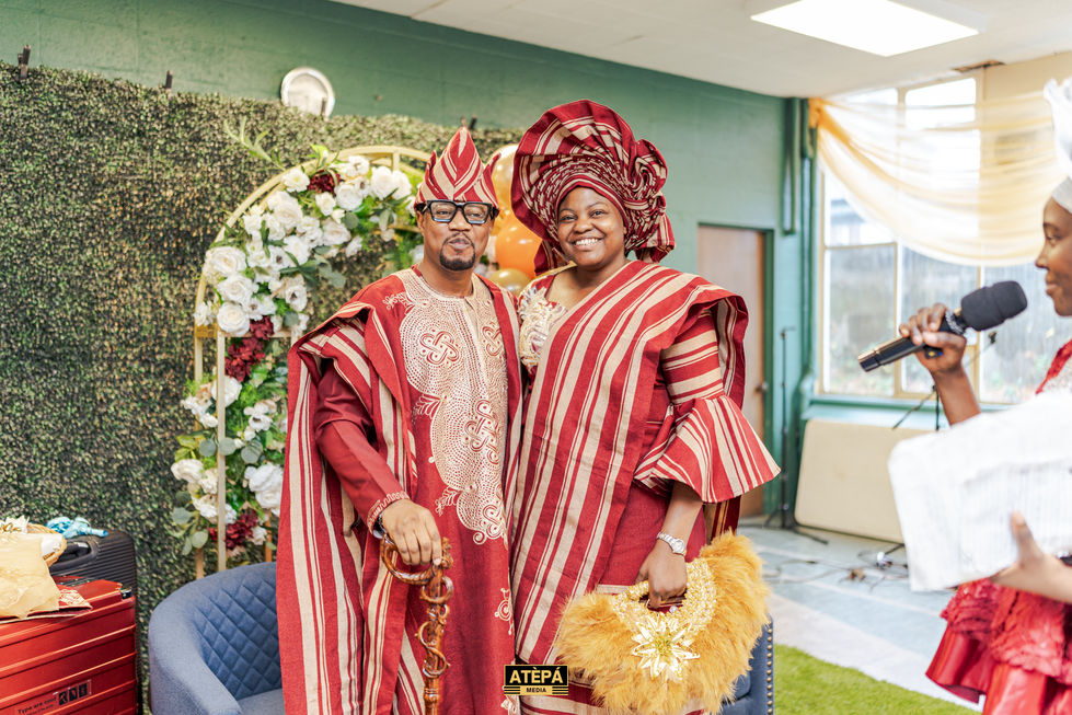 a man and a woman are posing for a picture with the word atepa on the bottom