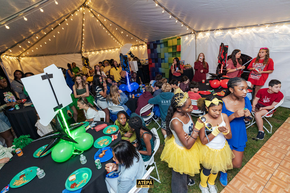 a group of people are gathered under a tent with the word atepa on the bottom
