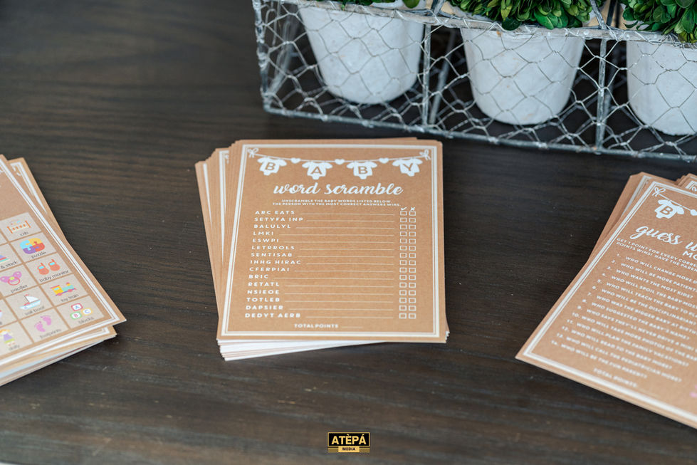 a stack of baby shower word scramble cards on a table