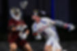 Dynamic shot captures an intense dodge against a defender under the lights, highlighting the competitive edge of the game.