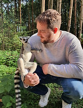 Sam with a lemur, reflecting care for a wide variety of animals and pets