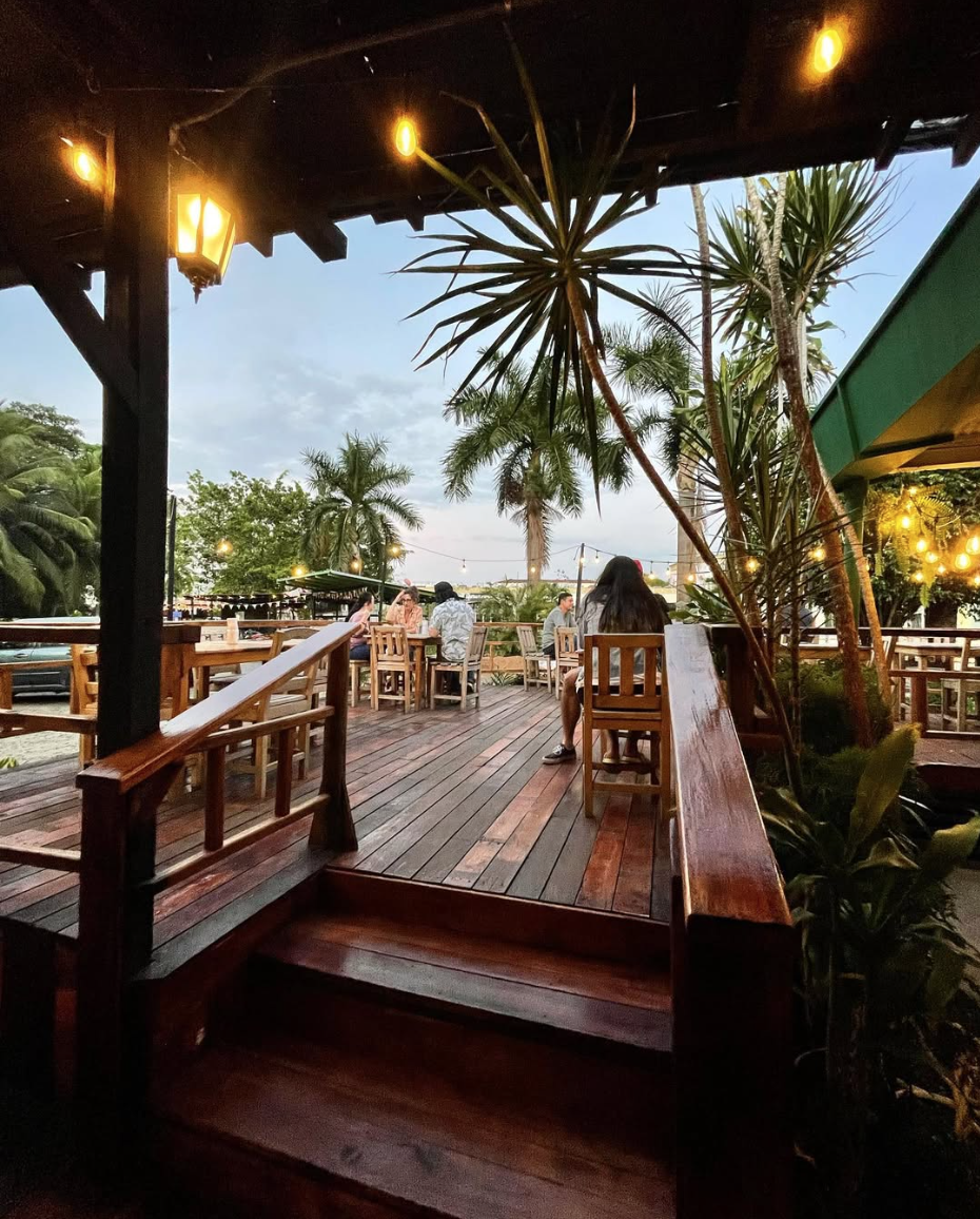 Teatro Escondido wooden terrace surrounded by palm trees