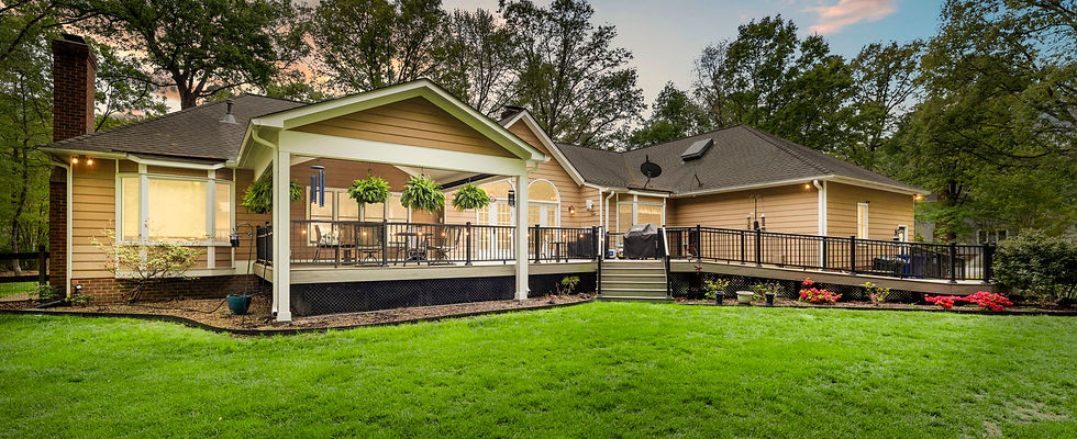 This multi-phase outdoor retreat in Midlothian's Powderham neighborhood features a custom handicap-accessible deck and a beautiful covered porch expansion. Built for a repeat client using premium TimberTech ProReserve decking in Driftwood and sleek black Impression rails, this two-part project perfectly blends inclusive design with high-end outdoor living.