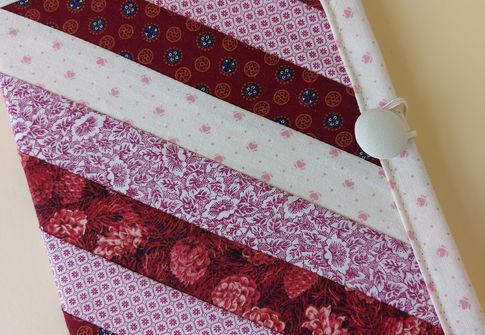 Fabric piecing is a fundamental technique in quilting and sewing where smaller pieces of fabric are sewn together to create a larger design. The beauty of fabric pieced designs lies in the uniqueness, and personal touch they bring to each project. The combination of different fabrics, colours, and patterns allows for an expression of creativity whilst the variety of shapes, colours, and textures in pieced designs creates a visually appealing and dynamic look.