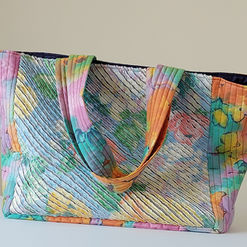 This larger than life Tote Bag created using the Chenille technique, with its plush texture and intricate details, truly makes this bag a feast for the eyes. Its roomy interior is capable of holding everything from a tiny lip balm to a whole galaxy of receipts, loyalty cards, and maybe even a forgotten snack or two, ideal when hitting the shops for a bit of retail therapy.