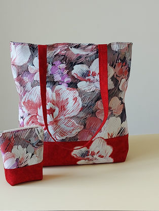 This Bag is the personification of elegance. It combines an attractive printed fabric, be it delicate florals or geometric patterns, with a complementary plain fabric which provides balance and contrasts beautifully. A motif, cut from the printed fabric is hand or machine appliqued to the plain fabric, adding a decorative embellishment. Practicality meets style! Long handles make this bag easy to carry. An internal pocket and secure zip closure keeps treasures safe. What more does it need?