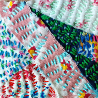 Stitch 22 Challenge - Decorative Applique Panel 1 uses a variety of stitches - chain stitch, cross stitch, fly stitch, bullion knot and back stitch. Panel 2 is using the scarecrow stitch. Panel 3 uses kantha stitch. Panel 4 uses couching. Panel 5 uses buttonhole stitch and cross stitch.