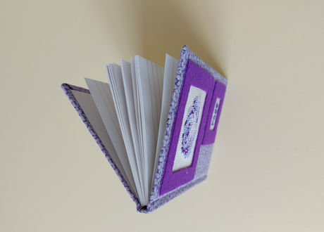 Casebound books covered in fabric are indeed beautiful and have a timeless appeal. The fabric cover and sturdy construction make these books long-lasting and able to withstand frequent handling and the feel adds a tactile dimension to the reading experience, making it more enjoyable. The covering can be made from a variety of textures and colours, giving each book a unique and elegant look. Each book is decorated with either applique or hand embroidery.