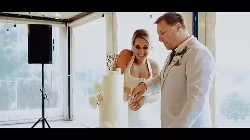 Wanaka Wedding Videography: Bride and groom cutting their wedding cake at The Rippon Hall.