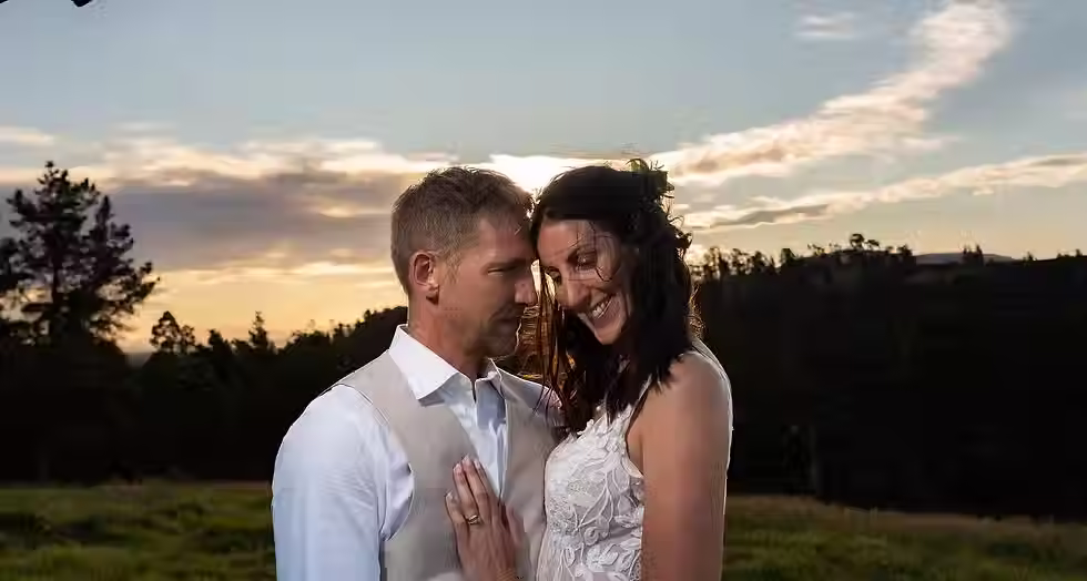 Christchurch wedding photographer showcases a candid close-up of a bride and groom smiling together during their sunset timeline shoot with Kiwi Moments Media.