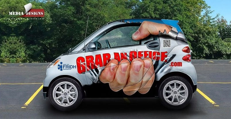 A giant hand gripping the vehicle… 3-D wrap design by Media Designs