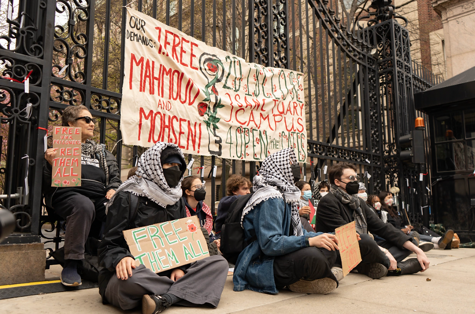 In Focus: Pro-Palestinian student and alumni protesters tether themselves to 116th Street and Amster