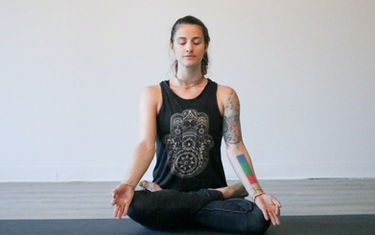 woman sitting in lotus posture meditating meditation yoga_edited.jpg