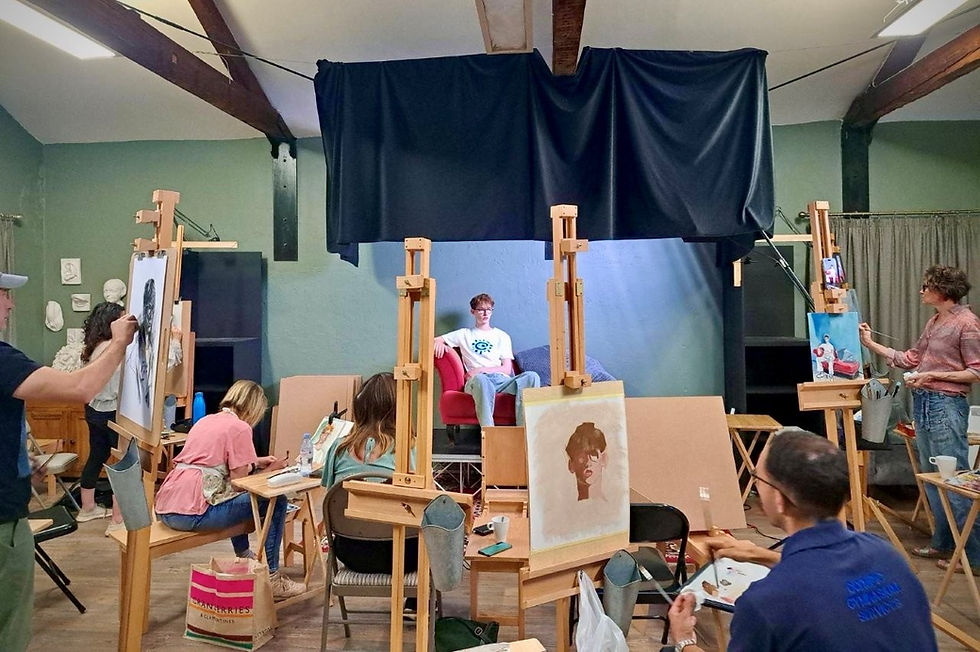 Art students paint a seated model in a green studio with easels, sketches, and a focused workshop mood.