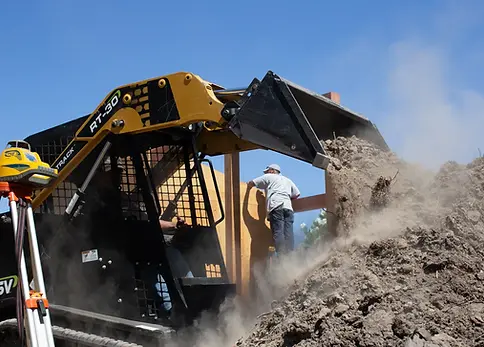 skid-steer-moving-soil-during-site-grading.webp