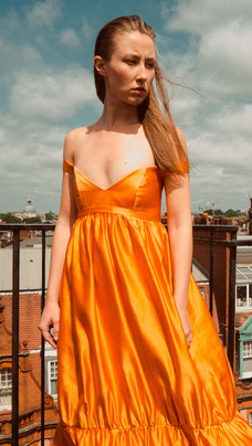 THE ITALIAN REVE, THE CROWN, NETFLIX, MALAN BRETON, ERIN DOHERTY, ORANGE GOWN, ROYALTY, HOLLYWOOD, ACTRESS.